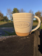 Load image into Gallery viewer, Handmade Happy Day Mug by Acorn Pottery on a fence post